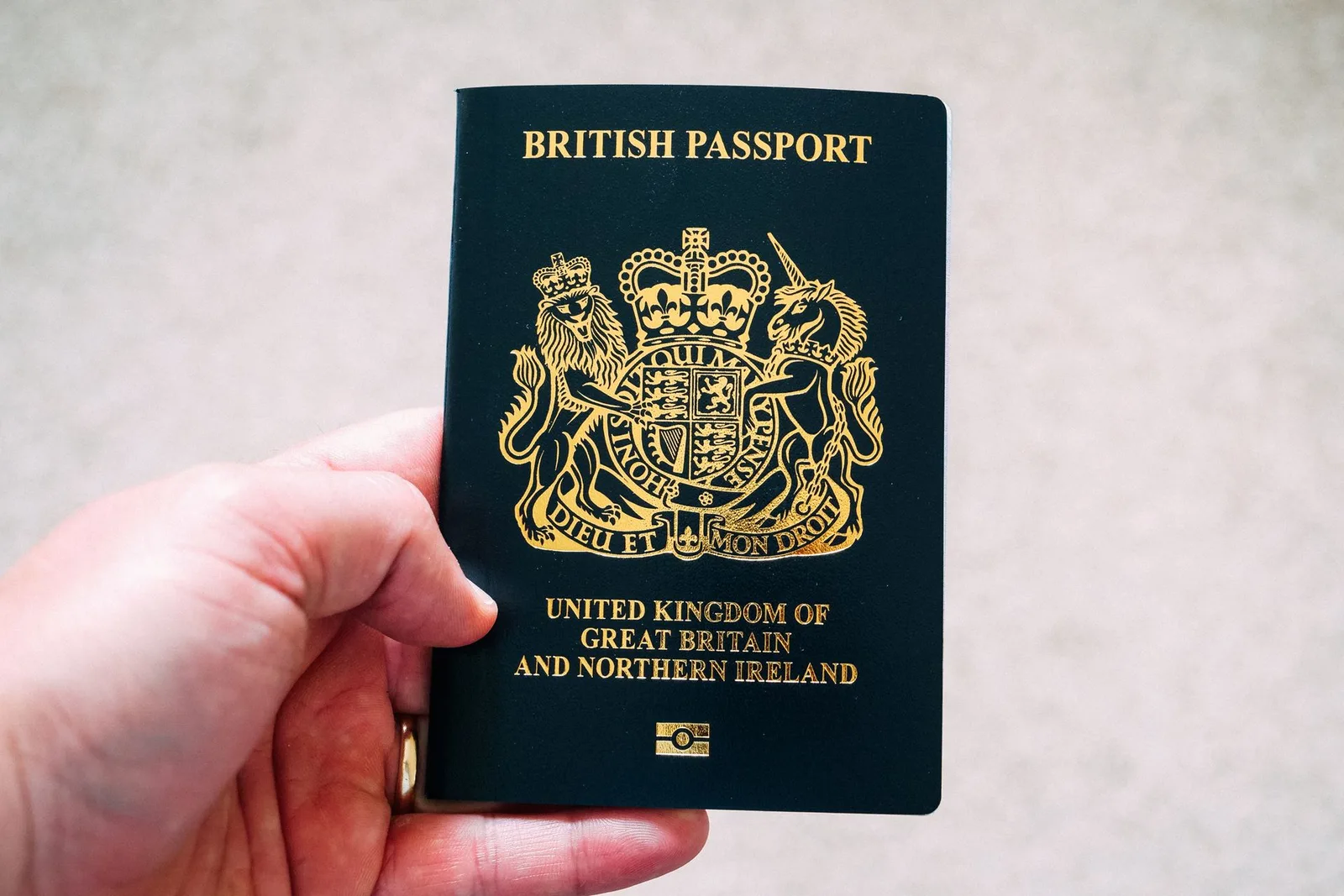 Immigration expert witness — A British passport held in hand
