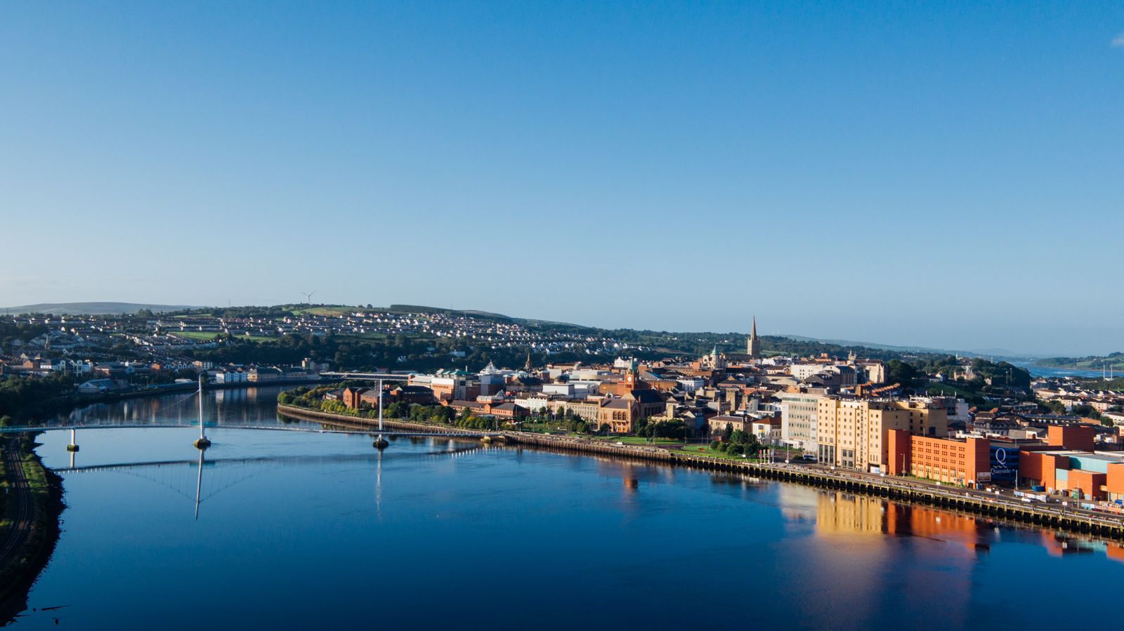Derry city and Peace Bridge over the River Foyle