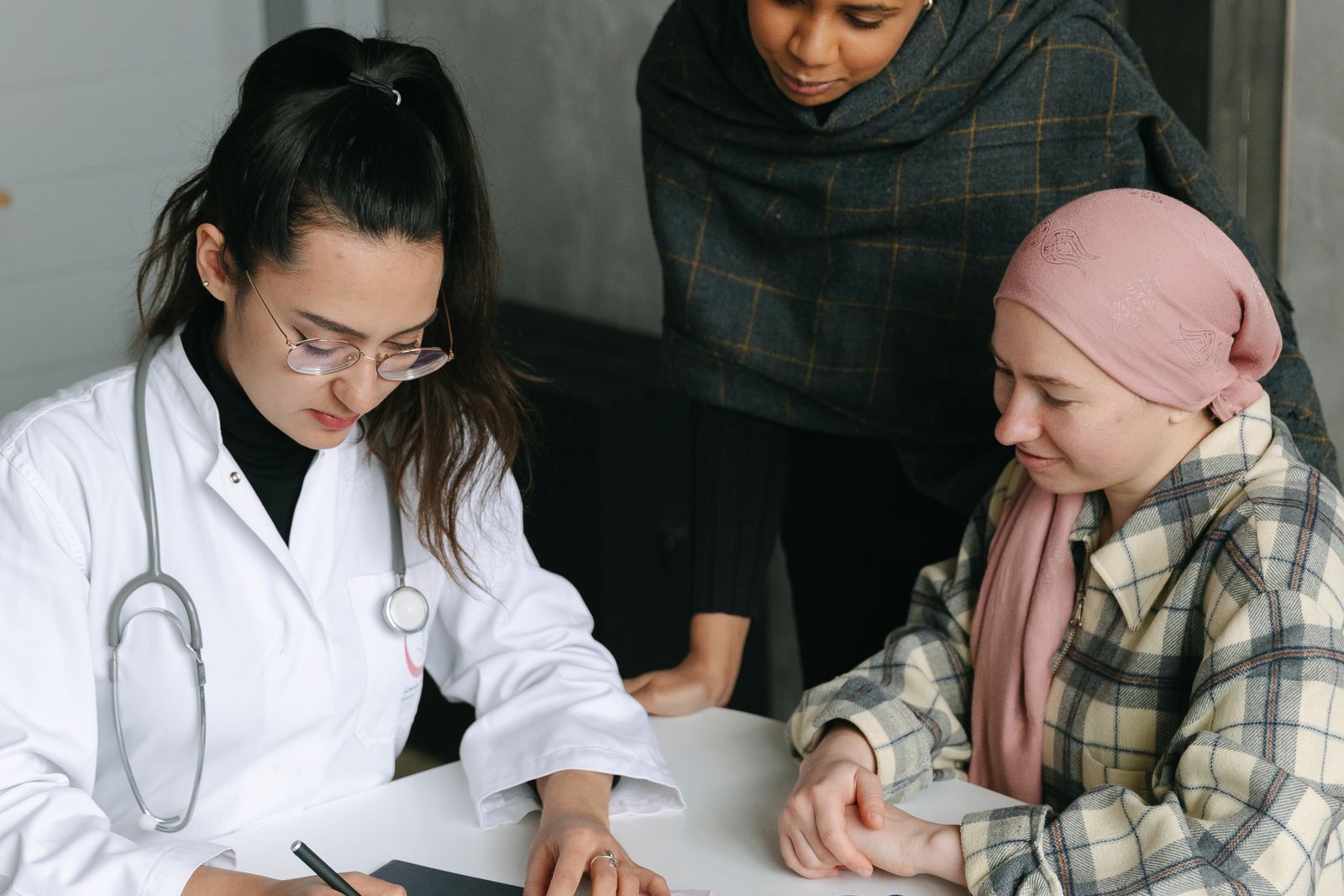 Clinician consulting a patient and relative, the setting genetic disease expert witnesses describe