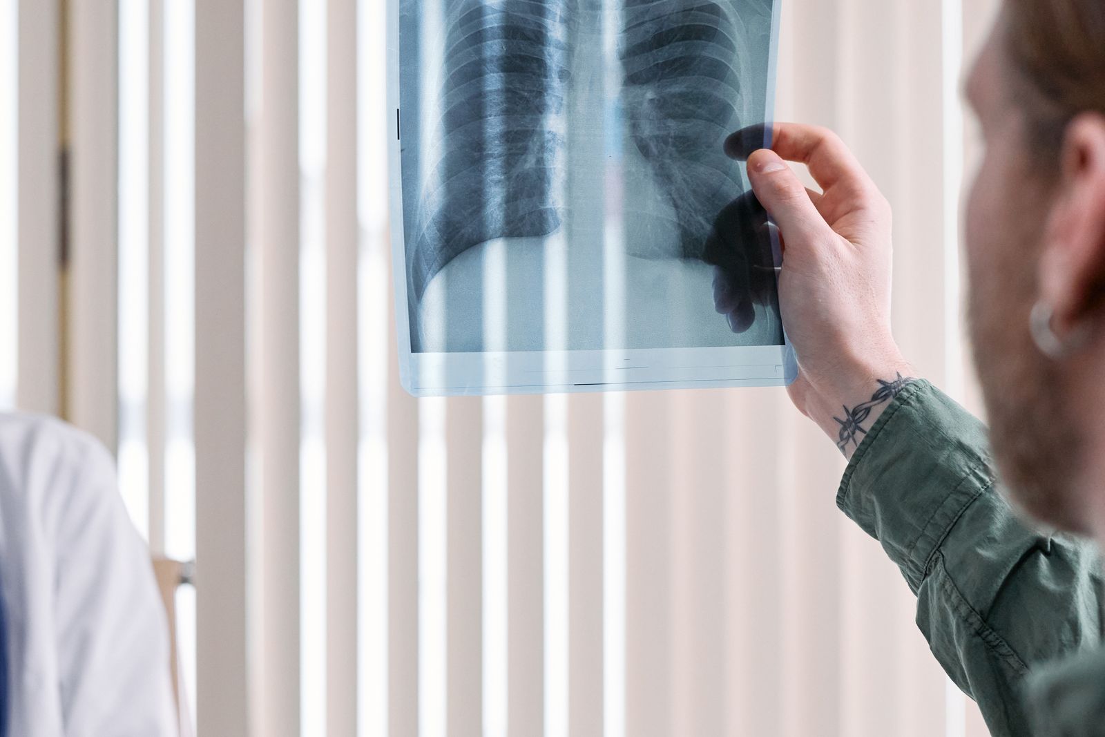 Clinician examining a chest radiograph, the imaging respiratory medicine expert witnesses interpret