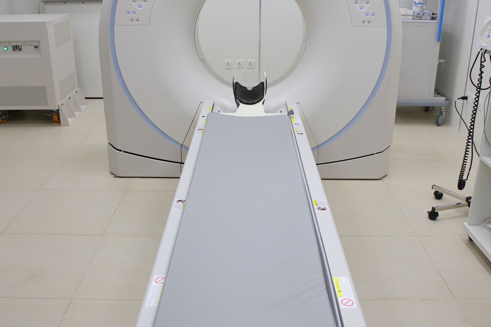 CT scanner in a hospital imaging room, the pathway stroke medicine expert witnesses examine