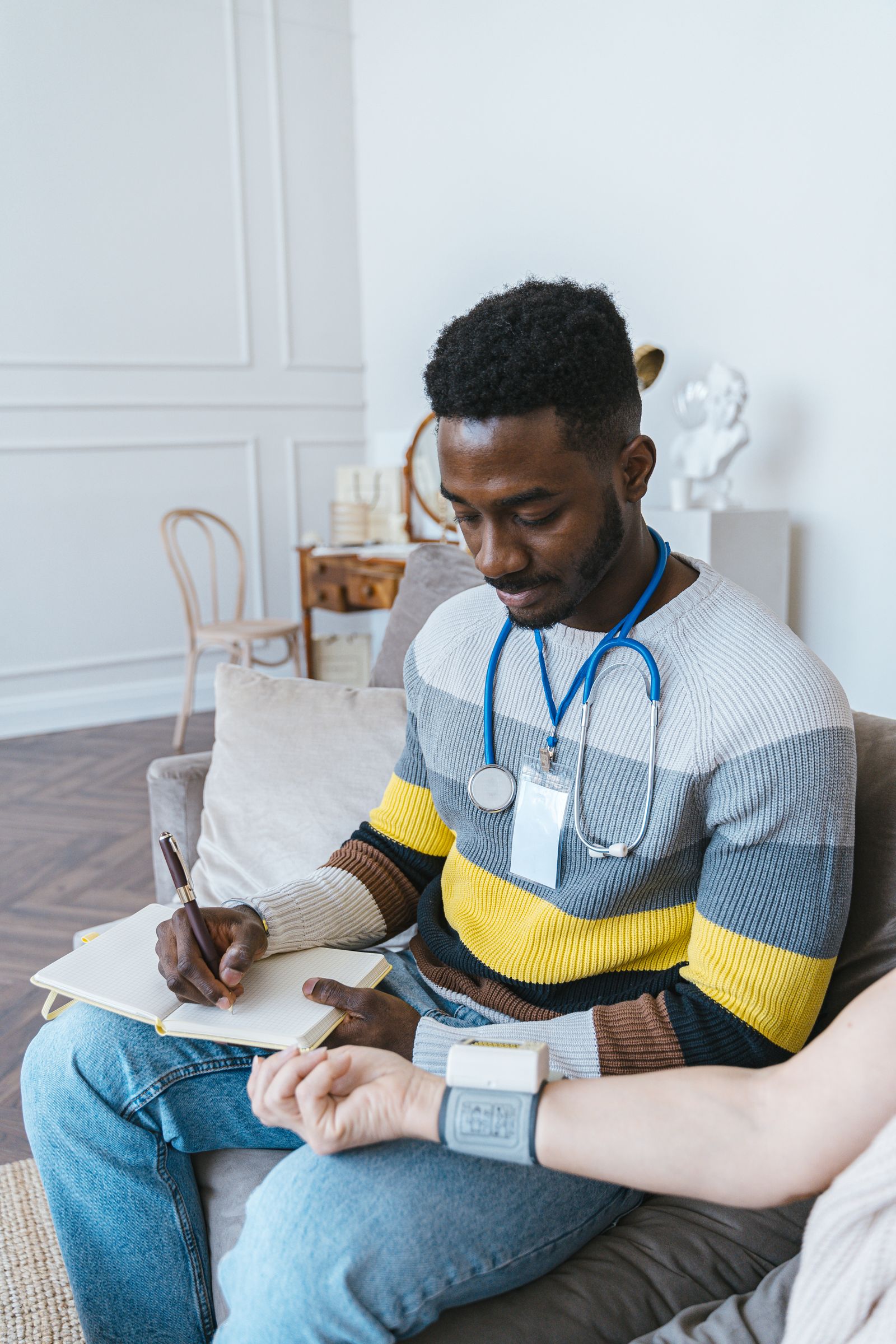 Personal injury expert witness — Clinician taking notes during a patient consultation
