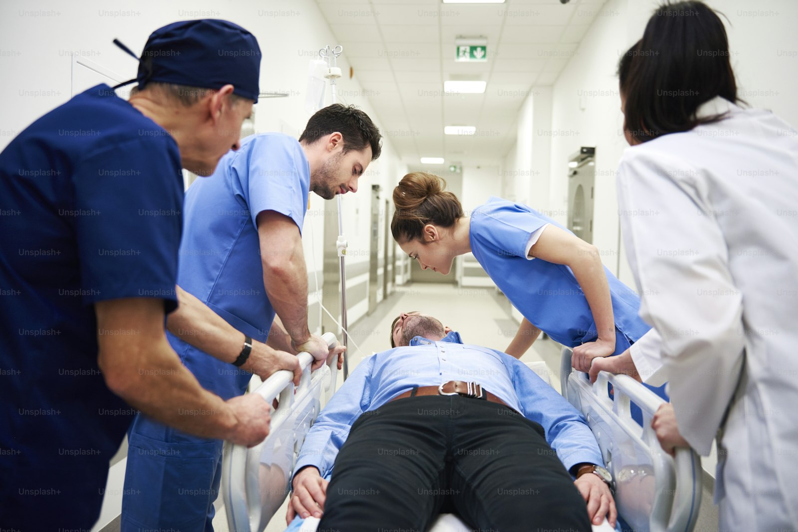 Clinicians at an emergency department entrance, the setting emergency medicine expert witnesses give evidence about