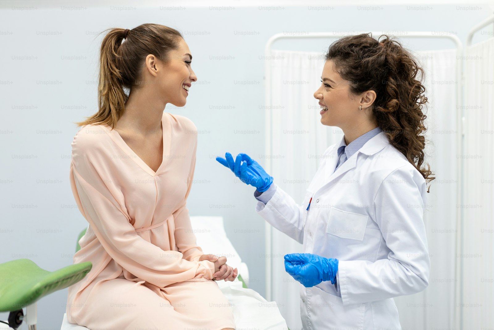 Clinician recording notes during an outpatient consultation, the care gynaecology expert witnesses examine