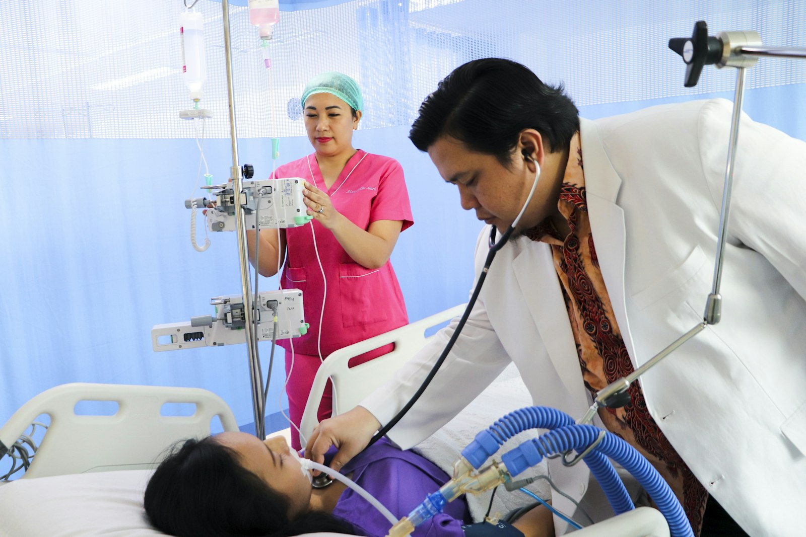 Nurse recording a patient’s blood pressure at the bedside, the care nursing expert witnesses assess