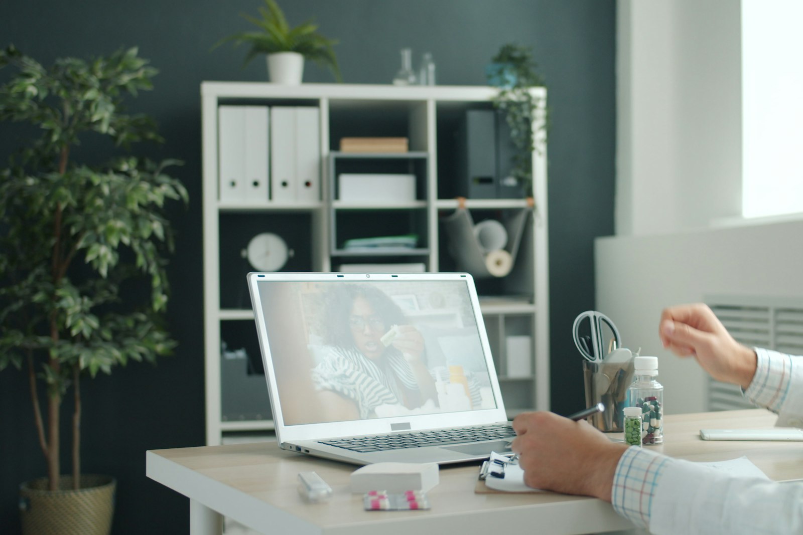 Clinician conducting a remote video consultation, the assessment tele triage expert witnesses review
