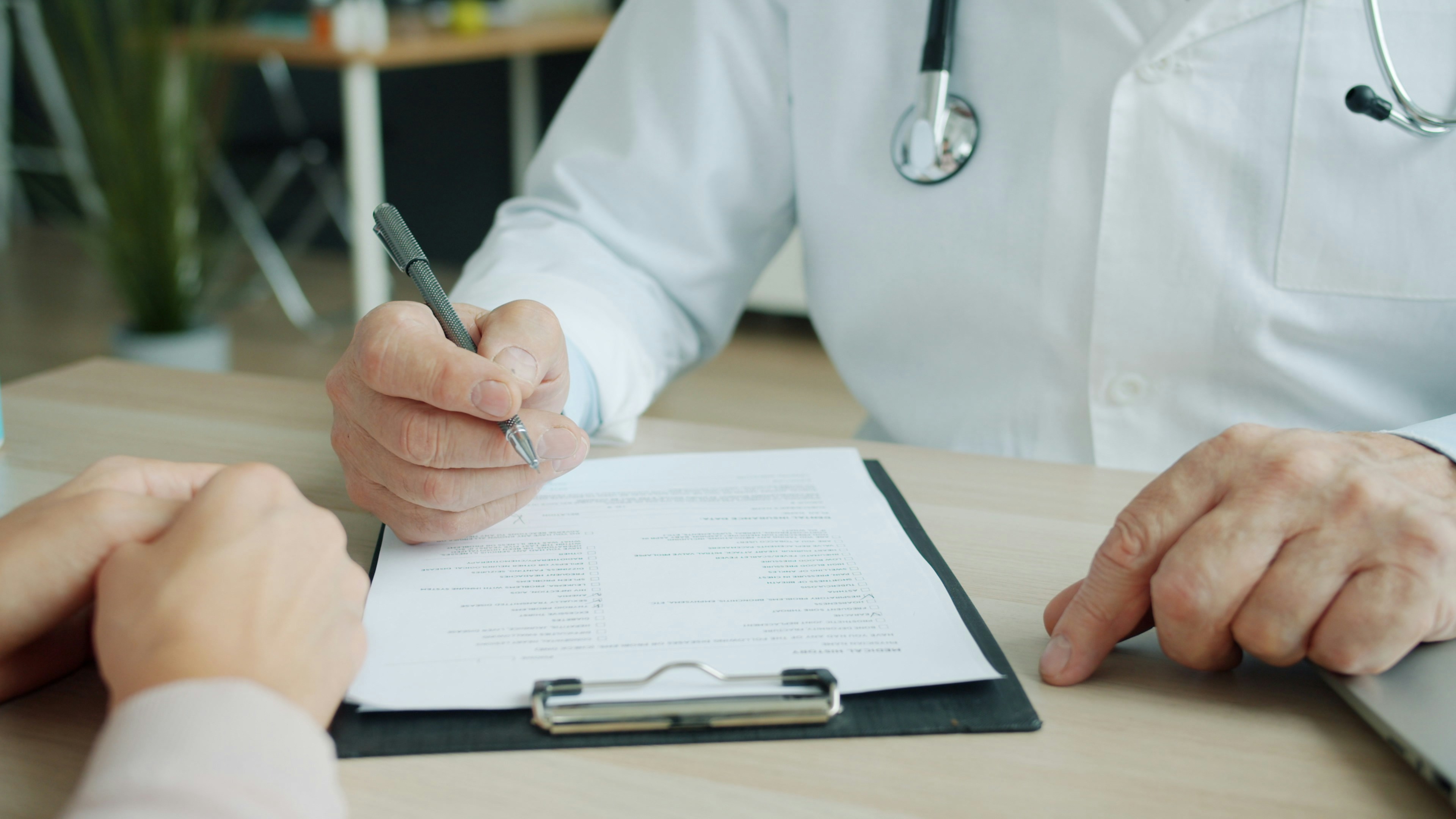 Clinician reviewing medical documentation with a patient