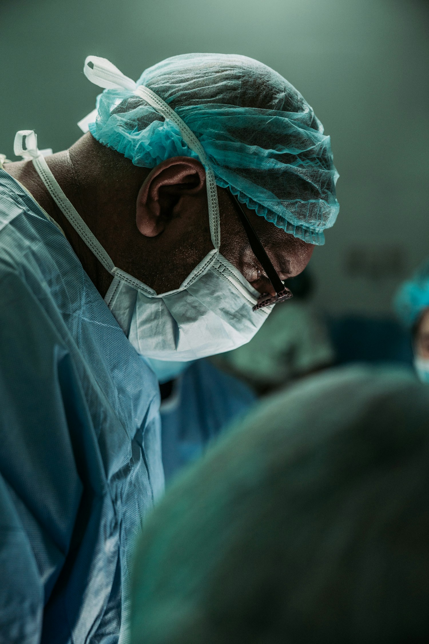 Medical practitioner in clinical protective clothing