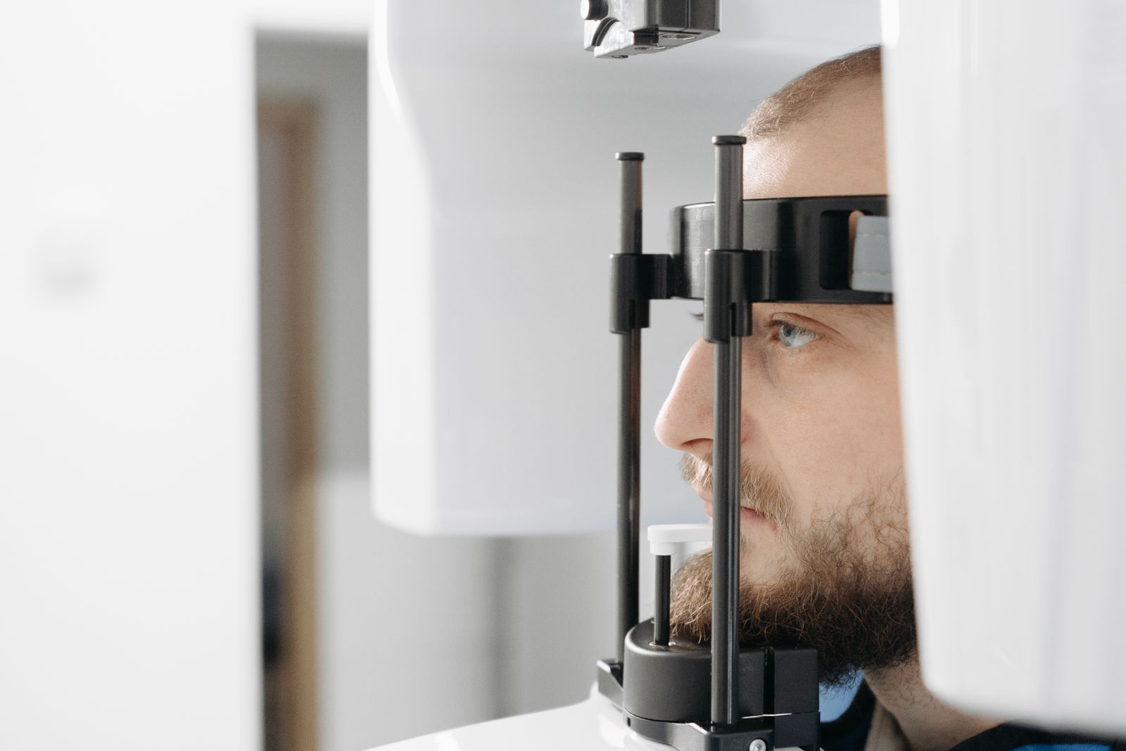 Patient undergoing facial imaging in a clinic, the assessment maxillofacial surgery expert witnesses review