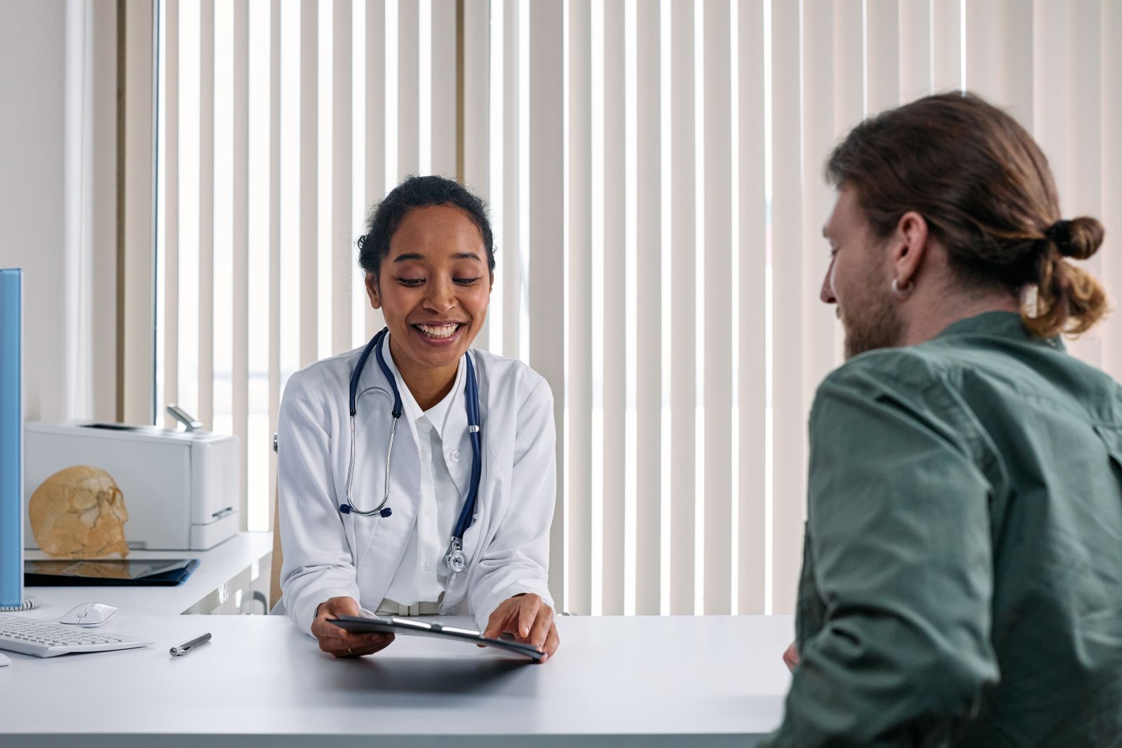 Clinician consulting a patient in a clinic, the assessment neuro-urology expert witnesses provide